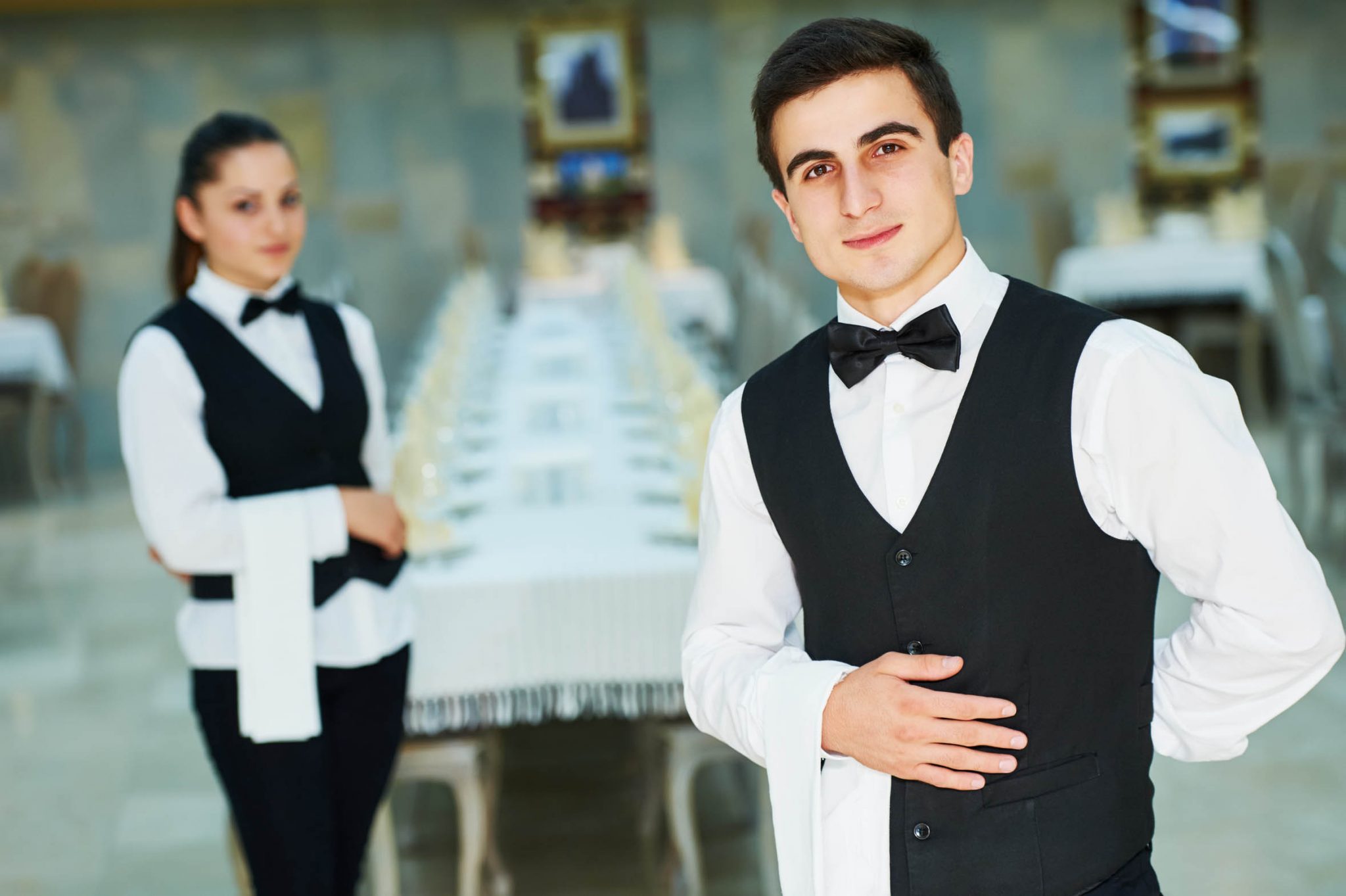 young waiter and waitress at service in restaurant adEvents event people